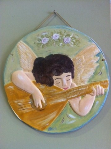 Hand-painted Ceramic Repousse plate.